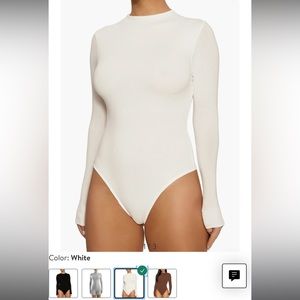Naked wardrobe white bodysuit. Size large. NWOT. Never worn only tried on.